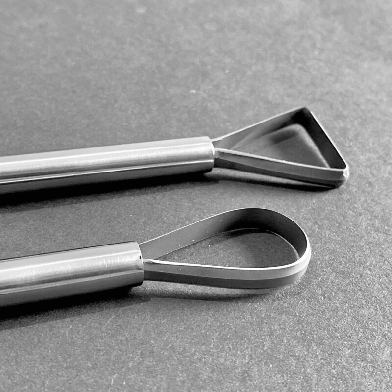 A Double Triangle Ended strip tool, And one with a Triangle and a Round End.